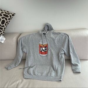 UNIVERSAL STUDIOS SIMPSONS DUFF BEER HOODIE BUILT IN KOOZIE AND BOTTLE OPENER
M
